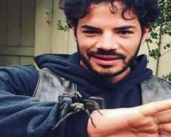 He is an animal lover and doesn't hesitate in picking them even if it is a freaky tarantula spider.